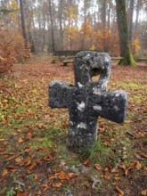 Medieval stone cross in the forest in autumn, atonement cross, murder cross, court cross, Spaal