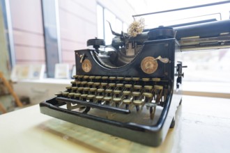 Antique typewriter in front of a window, nostalgic atmosphere, Gechingen Town Hall, Calw district,
