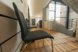 Modern, minimalistic interior with chairs and wooden tiles, Gechingen Town Hall, Calw District,