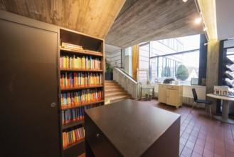 Modern interior design with bookshelves and large windows, Gechingen Town Hall, Calw district,
