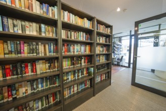Modern library with bookshelves and glass walls, cozy atmosphere, Gechingen Town Hall, Calw