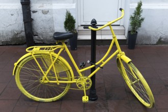 Bicycle painted yellow, Krakow, Poland