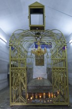Tomb of Hasidic Rabbi Elimelech in a gilded grid at the Lezajsk Jewish Cemetery, Poland