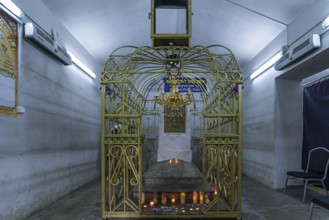 Tomb of Hasidic Rabbi Elimelech in a gilded grid at the Lezajsk Jewish Cemetery, Poland