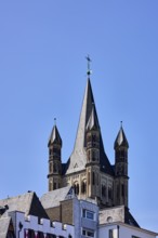 Church spire, church tower of Groß St. Martin, gable, pointed roofs, trees, blue sky, cloudless,