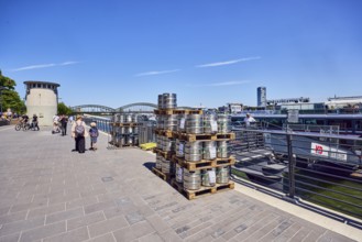 Pallets with beer barrels, boat launch, gangway, Rhine river, waterfront, level, metal railings,