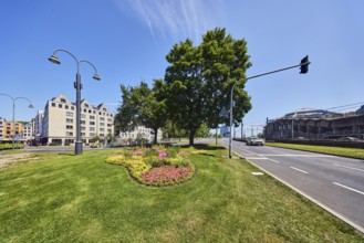 Road, traffic island, flower bed, lawn, trees, lantern, general architecture, building, bike path,