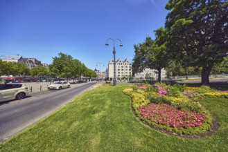 Traffic island, lawn, flower bed, trees, lantern, alleyway, taxi, taxi stand, general architecture,