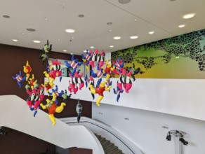 Colorful sculptures, Nanas, artist Niki de Saint Phalle, colorful figures, woman hanging in the