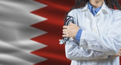Healthcare professional with Bahrain flag background. Professional doctor holding stethoscope on