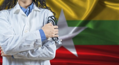 Healthcare professional with Myanmar flag background. Professional doctor holding stethoscope on