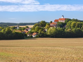 View of ploughed field at Schönfels Castle and Village in Lichtentanne, Saxony, Germany