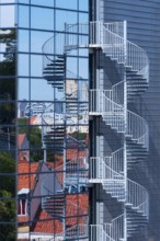 Modern glass façade with spiral staircase, fire escape, Erfurt, Thuringia, Germany