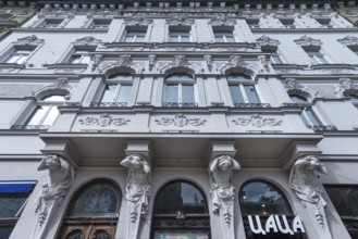 Atlases and cariatids under a balcony of a 19th century tenement house, Lviv, Ukraine