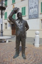 Italy, village of Brescello, the town hall, known from Don Camillo and Peppone, with a bronze