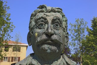 Brescello, statue of the writer Giovannino Guareschi in Parco Giovannino Guareschi, author of the