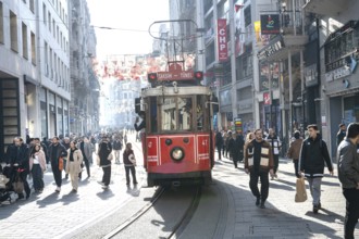 Istanbul, Turkey. December 2nd 2025. A traditional Turkish tram along street, busy with shoppers