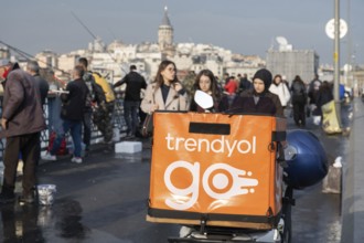 Istanbul, Turkey. December 2nd 2025. A Trendyol delivery motorbike parked on the Galata Bridge,