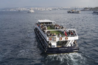 Istanbul, Turkey. December 2nd 2025. A Turkish tour boat with tourists leaves the Golden Horn and