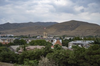 Gori, Georgia. September 9th 2025. Panoramic landscape view with the Georgian flag flying from the
