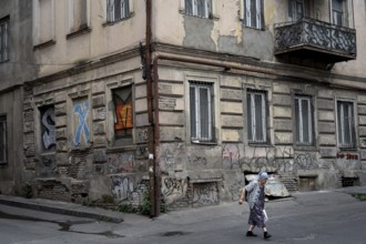 Tbilisi, Georgia. July 15th 2025. An elderly Georgian lady crossing the street in the downtown