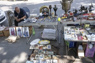 Tbilisi, Georgia. July 11th 2025 Street stall vendor at the Dry Bridge Flea Market selling antiques