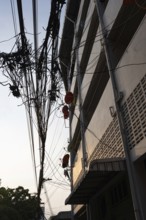 Bangkok, Thailand. March 4th 2025. A tangled mess of cables and wires used for phone and internet