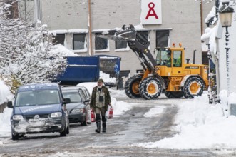 Loader clearing snow on streets in Ystad, Skåne County, Sweden, Scandinavia