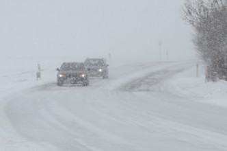 Traffic in a snowstorm on a country road in Ystad municipality, Skåne county, Sweden, Scandinavia