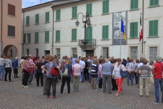 Group of visitors in the town of Don Camillo and Peppone, Brescello, Emilia-Romagna, Italy