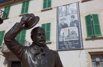 Italy, village of Brescello, the town hall, known from Don Camillo and Peppone, with a bronze