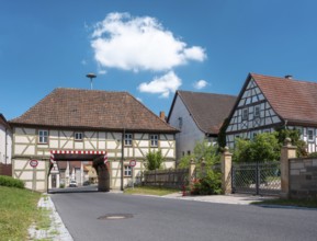 The gatehouse of Trappstadt, town hall, half-timbered house from 1728 with passage, Trappstadt,