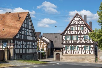 Farms with typical Franconian half-timbered houses in the village of Serrfeld, Sulzdorf an der