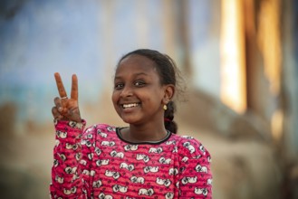 Aswan, Egypt. December 10th 2022 Pretty happy smiling young Nubian girl in the Nile side Nubian