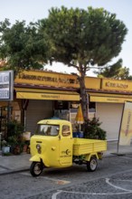 Akyaka, Mugla, Turkey. September 8th 2022 A bright yellow delivery van parked outside a market shop