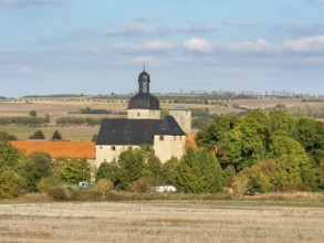 View over stubble field to Zilly Castle in the Harz foothills, Osterwieck, Saxony-Anhalt, Germany