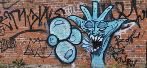 Creative graffiti on a brick wall in shades of blue, Olsztyn, Masuria, Poland