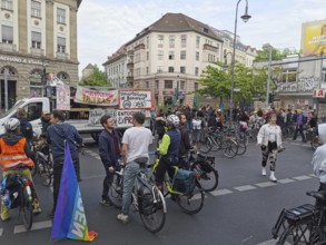May Day, large crowd on Labor Day with bicycles and banners at an urban demonstration, Maidemo,