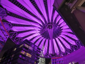 Illuminated roof of the Center am Potsdamer Platz in Berlin in bright pink, with futuristic design,