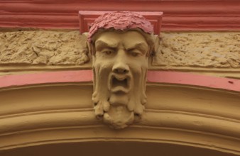 Romania, face above a house entrance in the historic old town of Sighisoara, German Sighisoara,