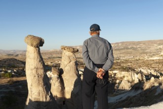Urgup, Cappadocia, Turkey. September 18th 2018 A Turkish man enjoys the beautiful view of the Three