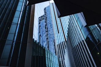 Modern abstract reflections in glass fronted office buildings in the financial district of the