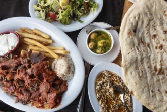 Alanya, Turkey. April 8th 2021 Plate of Iskender or Bursa Kebab with a Turkish mezze and