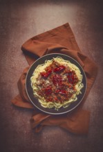 Spaghetti bolognese, with dried tomatoes, homemade, close-up