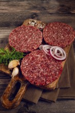 Raw cutlets, for burgers, minced meat, handmade, homemade, with spices, top view, no people