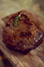 Grilled steak, beef steak, rib eye steak, on a chopping board, top view, no people