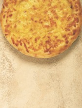 Khachapuri in Megrelian, a traditional Georgian dish, flatbread with cheese, top view, no people