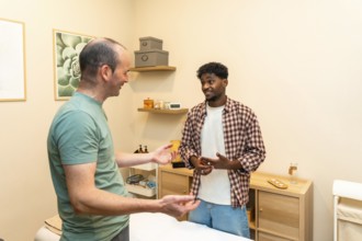 Two men engaging in a friendly and professional conversation about health and wellness, consulting