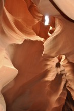 Light transmission through narrow openings in the curved sandstone canyons of a sandstone canyon,