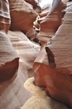 Earthy layers in a sandstone canyon that have formed narrow paths due to erosion, Antelope Canyon,